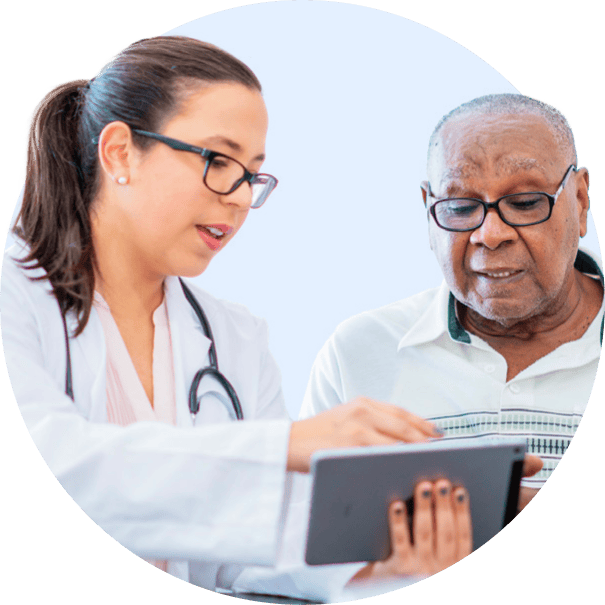 Doctor explaining information to an elderly patient using a tablet